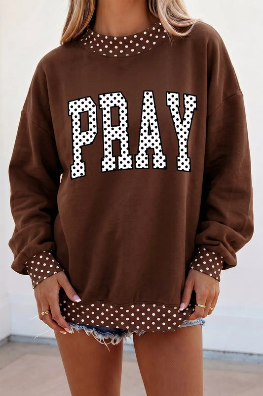 Dark brown PRAY graphic sweatshirt with polka dot trim, front view